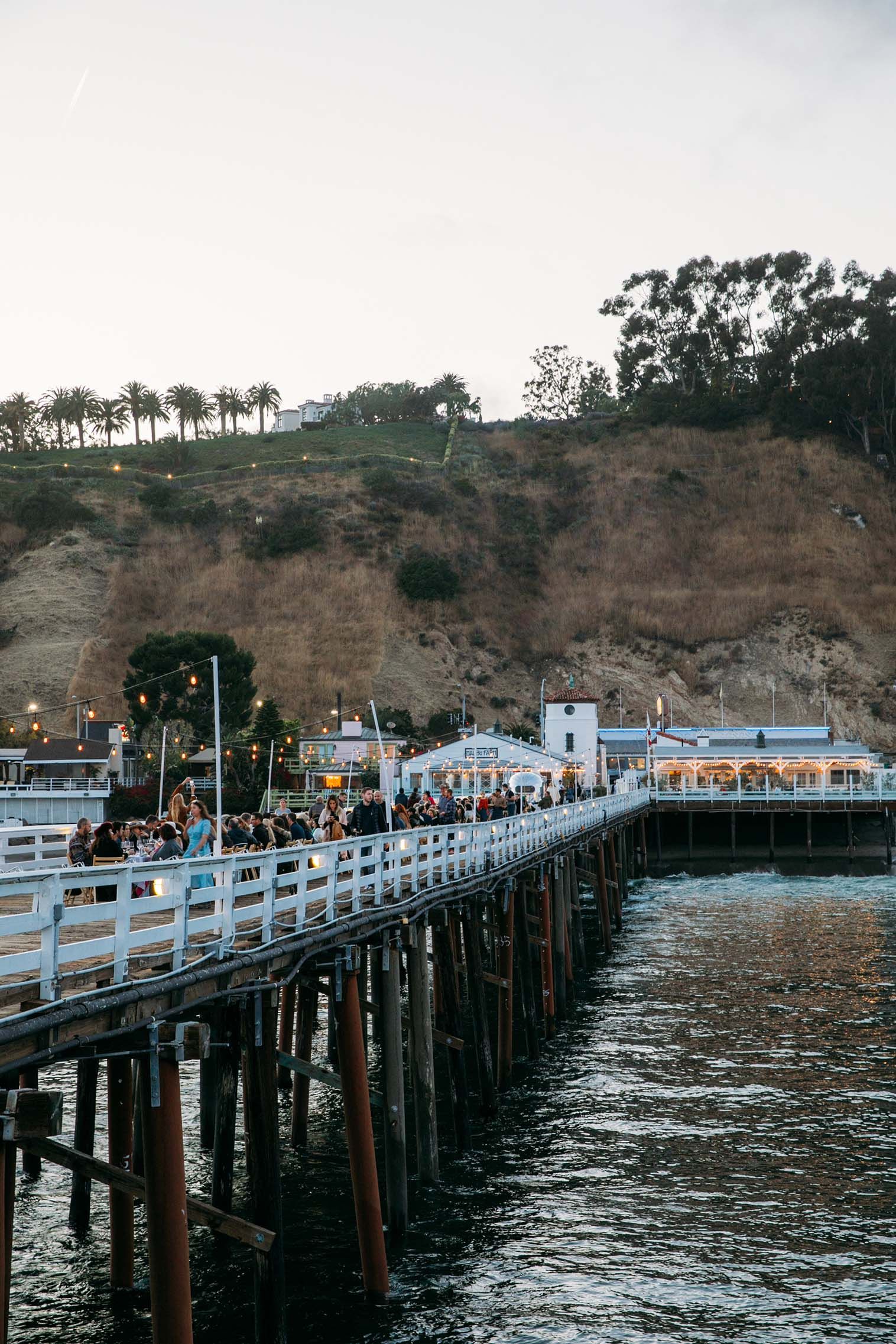 Outstanding in the Field Celebrates Its 20th Anniversary With a Malibu Pier Party & Massive Tour
