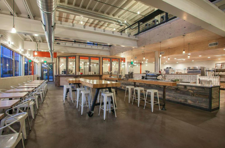 Publik Coffee House an industrial urban building offering coffee and event space.