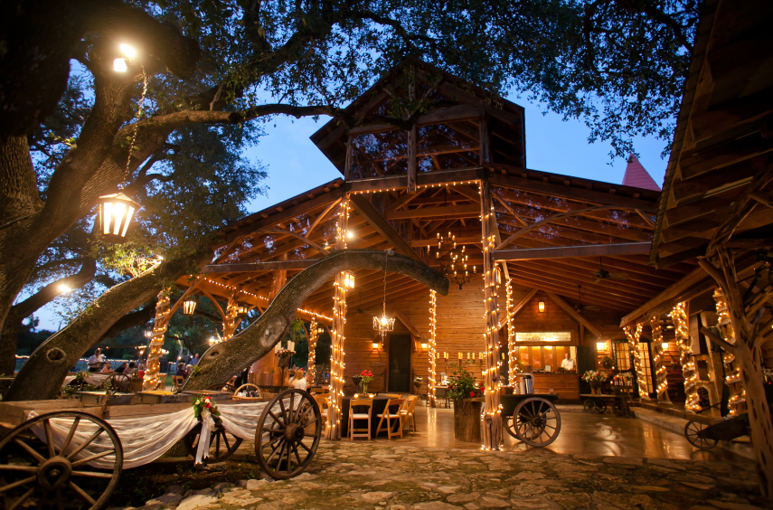 Chapel Hall Covered Patio has hill country views & is adjacent to Chapel Hall. Ideal for:  receptions, cocktail hour, gatherings of all kinds. Adorned with soft twinkle lights & crystal chandeliers hanging from Oaks.
