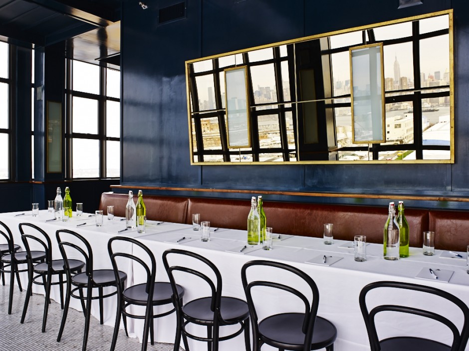 Art Deco-inspired rooftop bar space with unobstructed views of the Manhattan skyline.