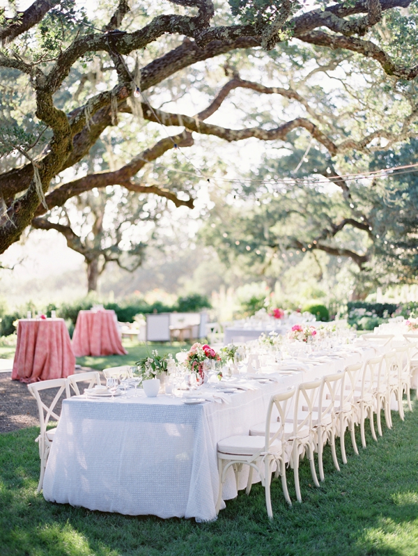 Long tables on the garden lawn designed by Flowerwild and Rosemary Events