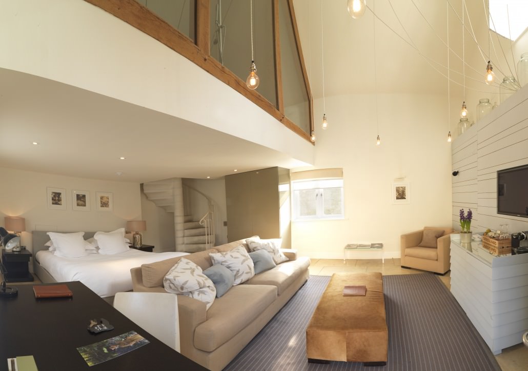 Stableyard Room, on open floor plan, spiral staircase & Turkish bathtub.