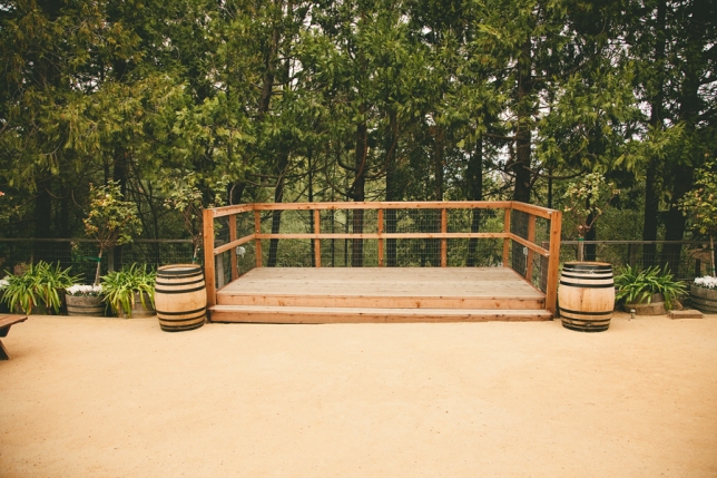 The outdoor patio with its forested backdrop is an unforgettable canvas for a ceremony or wine reception.