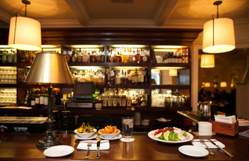 Order a drink at the bar.