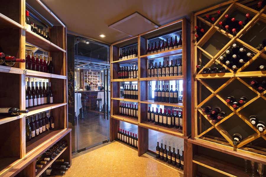 Catching your eye when you enter the restaurant, a brand new 130 square foot glass encased wine cellar as well as a refurbished 21 foot bar from the 1800’s, previously housed in a mercantile shop in Montana, speak to the recent renovations.