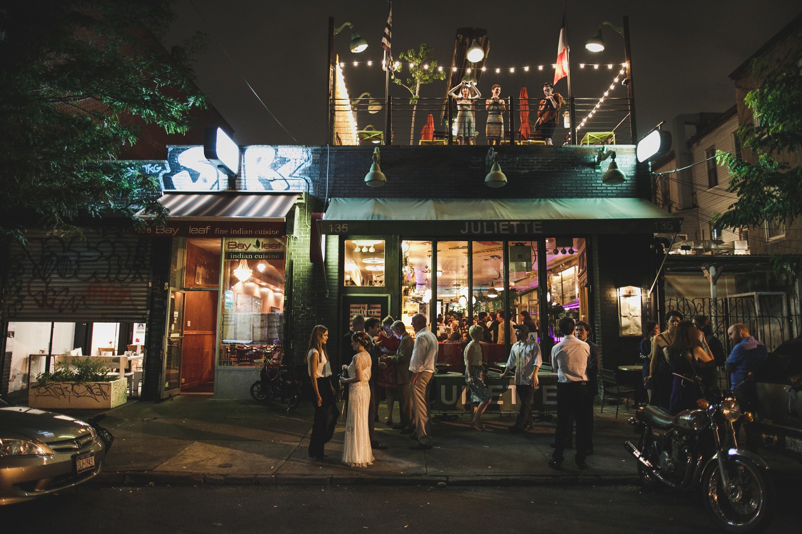 The open-air rooftop terrace, elevated above the bustle of the streets, preserves the quaint seclusion of an intimate café.
