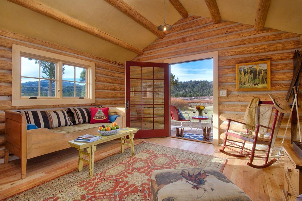 Situated on the banks of the Buffalo Fork River, each of our Grand Teton cabins features custom handmade furniture draped with stylish Pendleton blankets, cozy gas-lit fireplaces and upscale bath amenities.