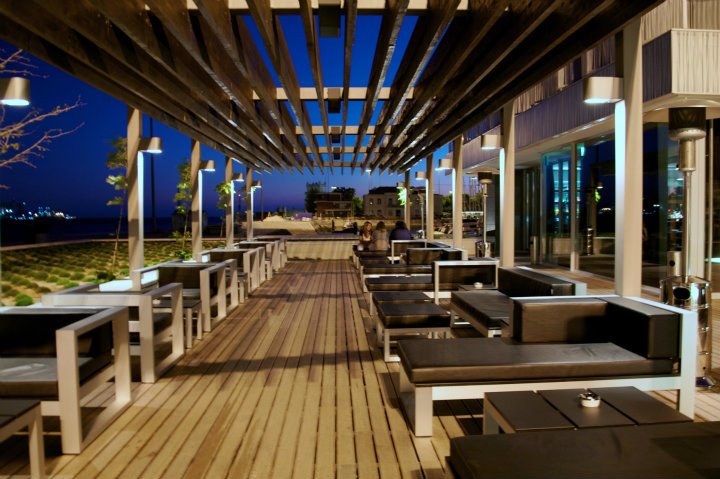 A indoor and outdoor bar with a covered deck for special events.