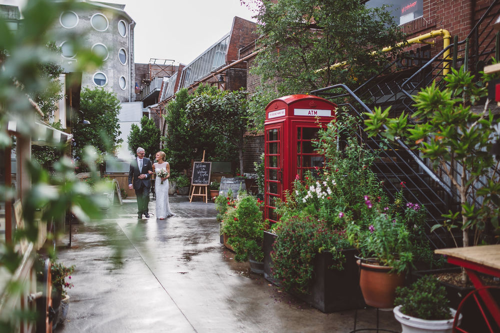 A crumbling brick wall covered with creeping vines, bountiful greenery and a generous scattering of fairy lights throughout the garden creates an inner-city sanctuary that makes for a beautiful event, day or night.