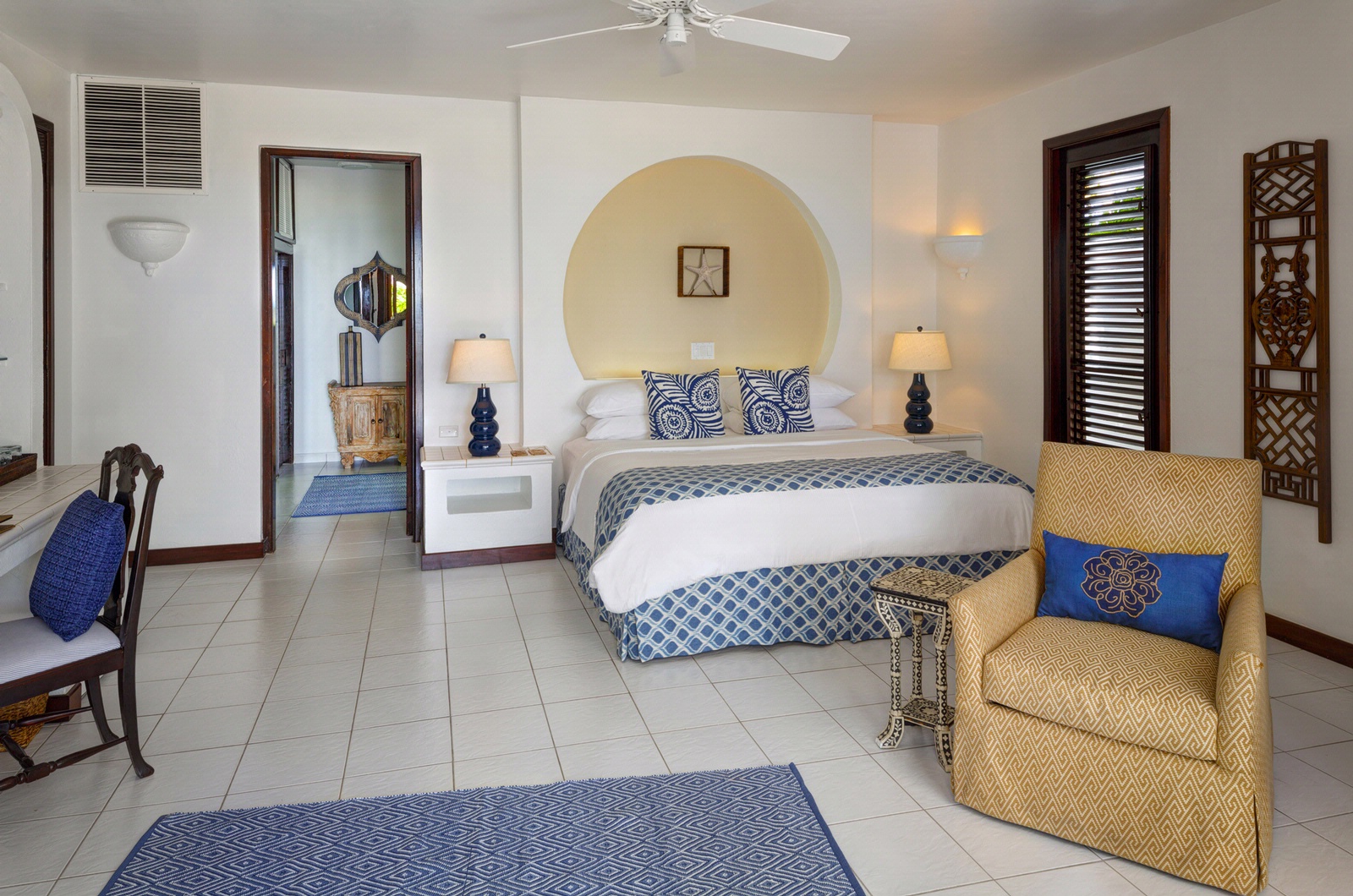 Beachfront luxury guestroom with clean decor.