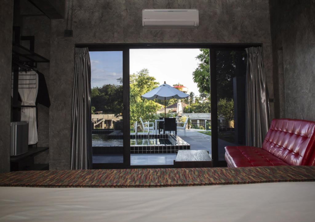 A rooftop patio with a view of the surrounding temples and mountains.