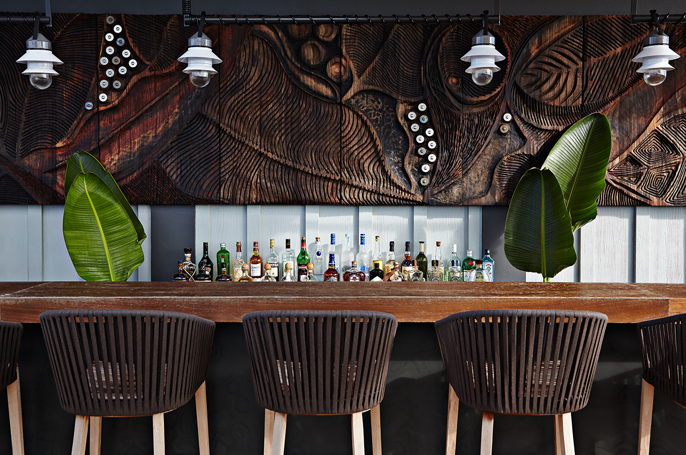 Grab a drink by the bar.