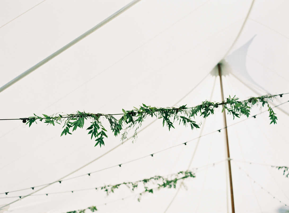 Greener garland in tented reception.