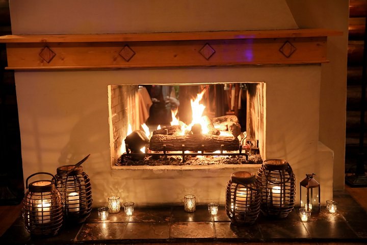 Cozy up by the fireplace.