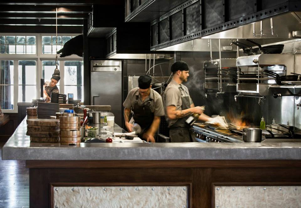 Exposed kitchen provides a fun restaurant experience.