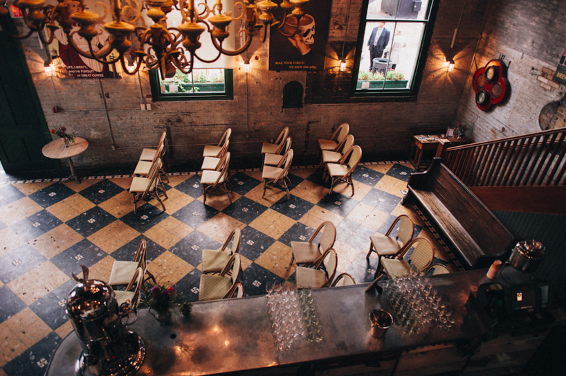 The cafe quickly converts into a bar with a dance floor on the main level, while the upstairs gallery can either be converted into a dining room or remain a cozy lounge