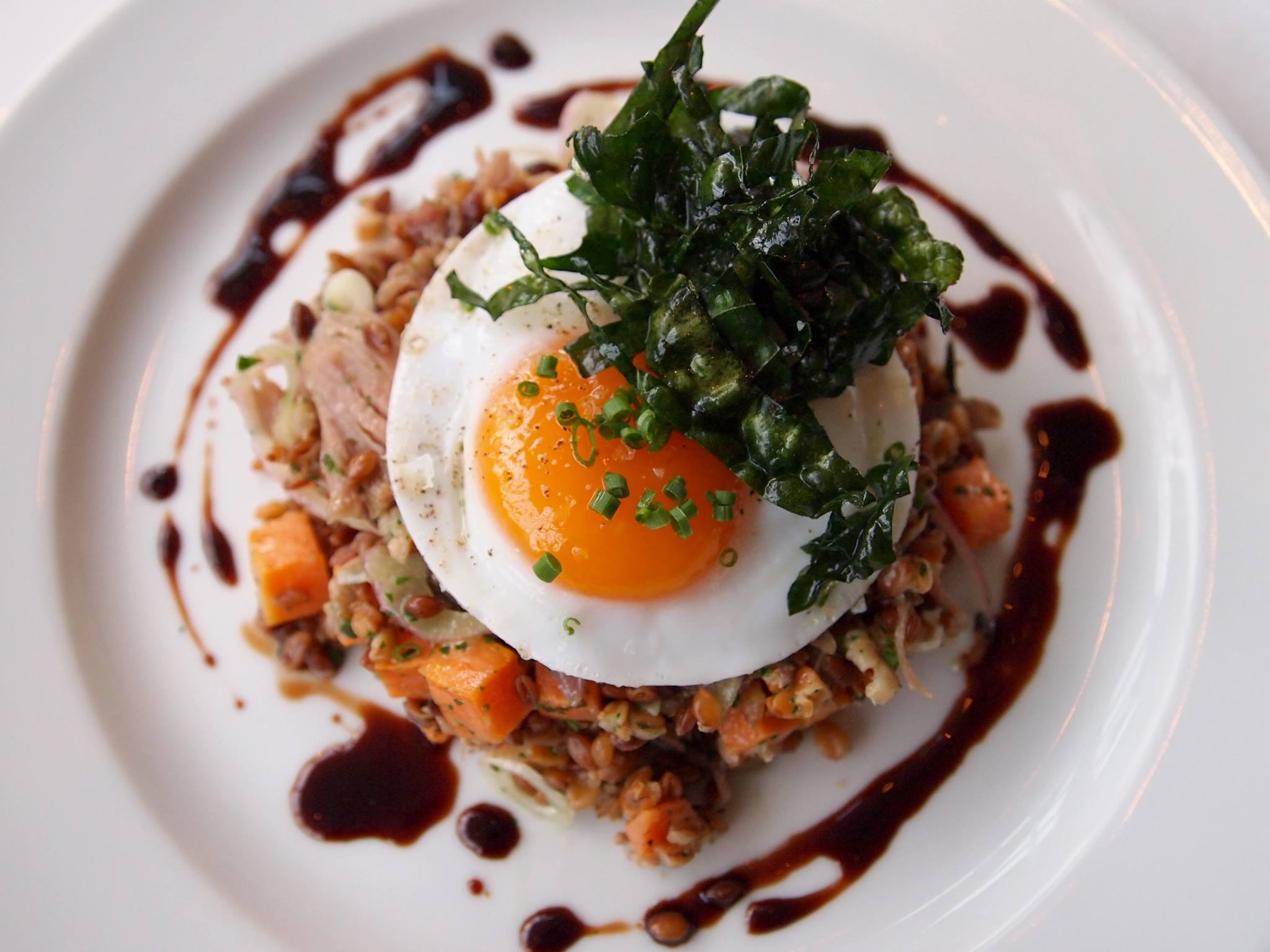 Toasted farro salad, with Blue Valley Gardens duck confit, sweet potatoes, shaved red onion, crispy lacinato kale, sunny side up duck egg, and aged balsamic.