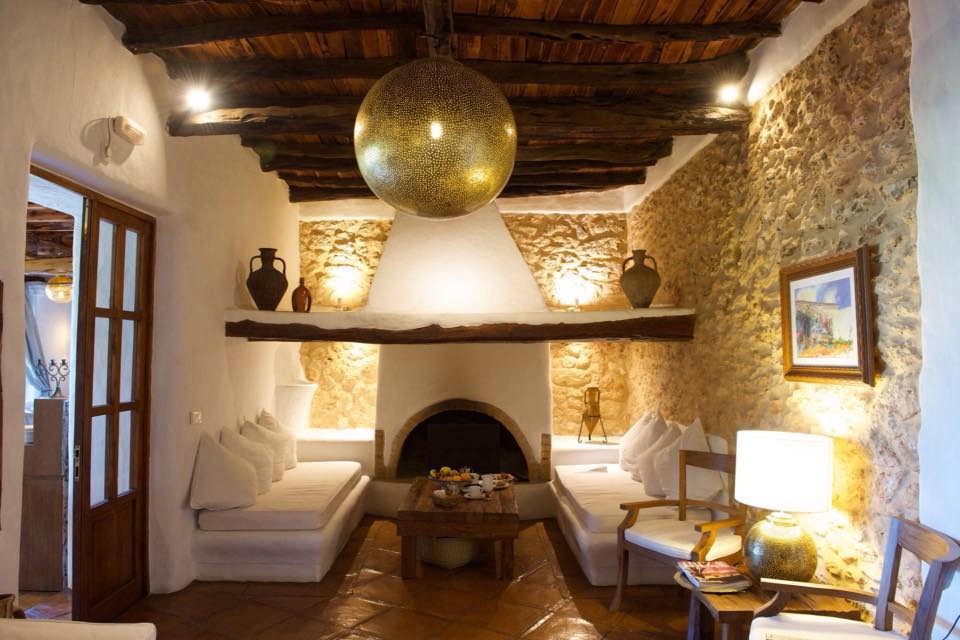 Cozy up by the fireplace with a glass of wine.