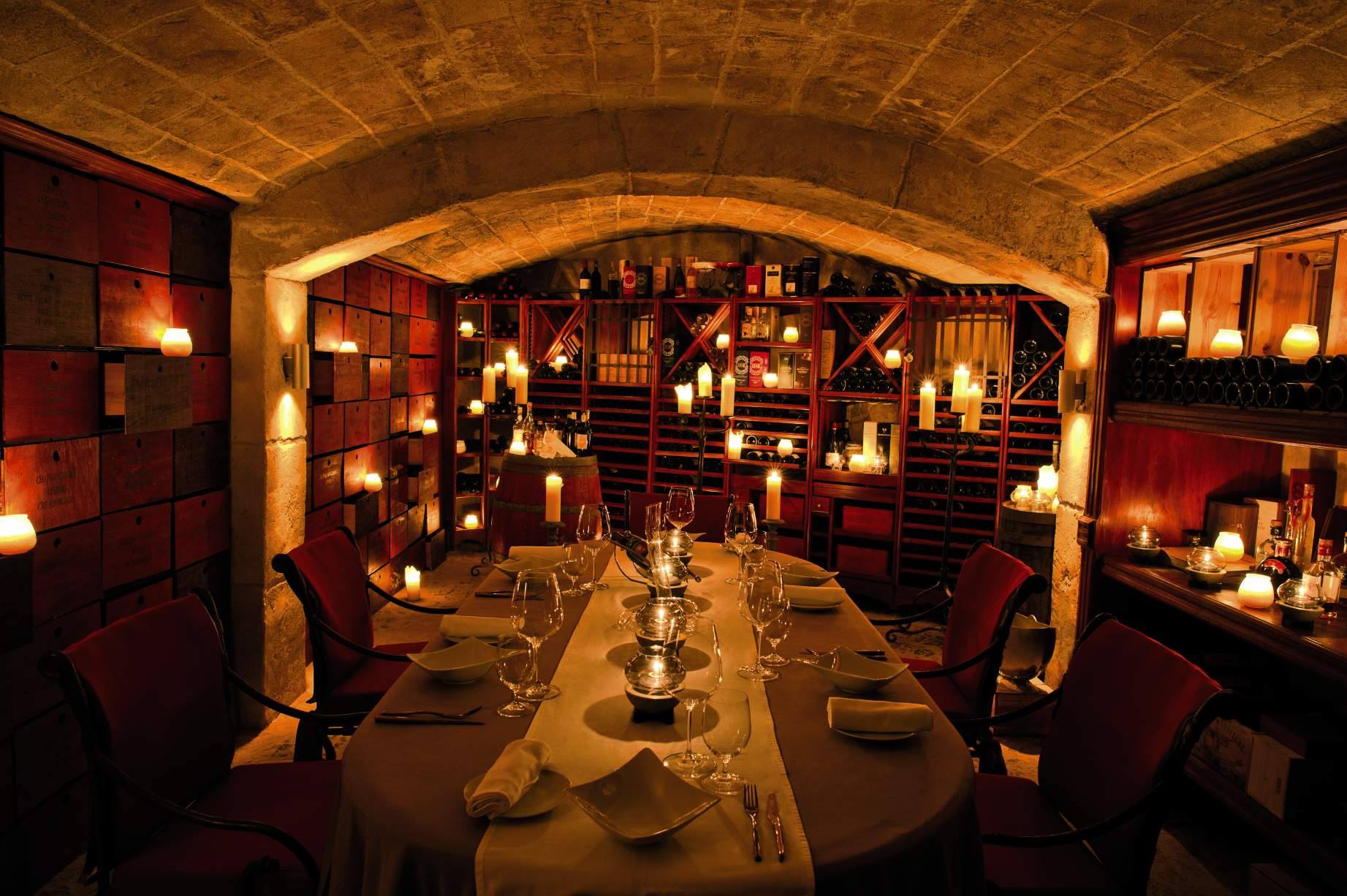 La Cave offers a unique dining experience in an atmospheric wine cellar. Curate your own tasting menu with an expert chef, complemented by the fine wines that line the cellar.