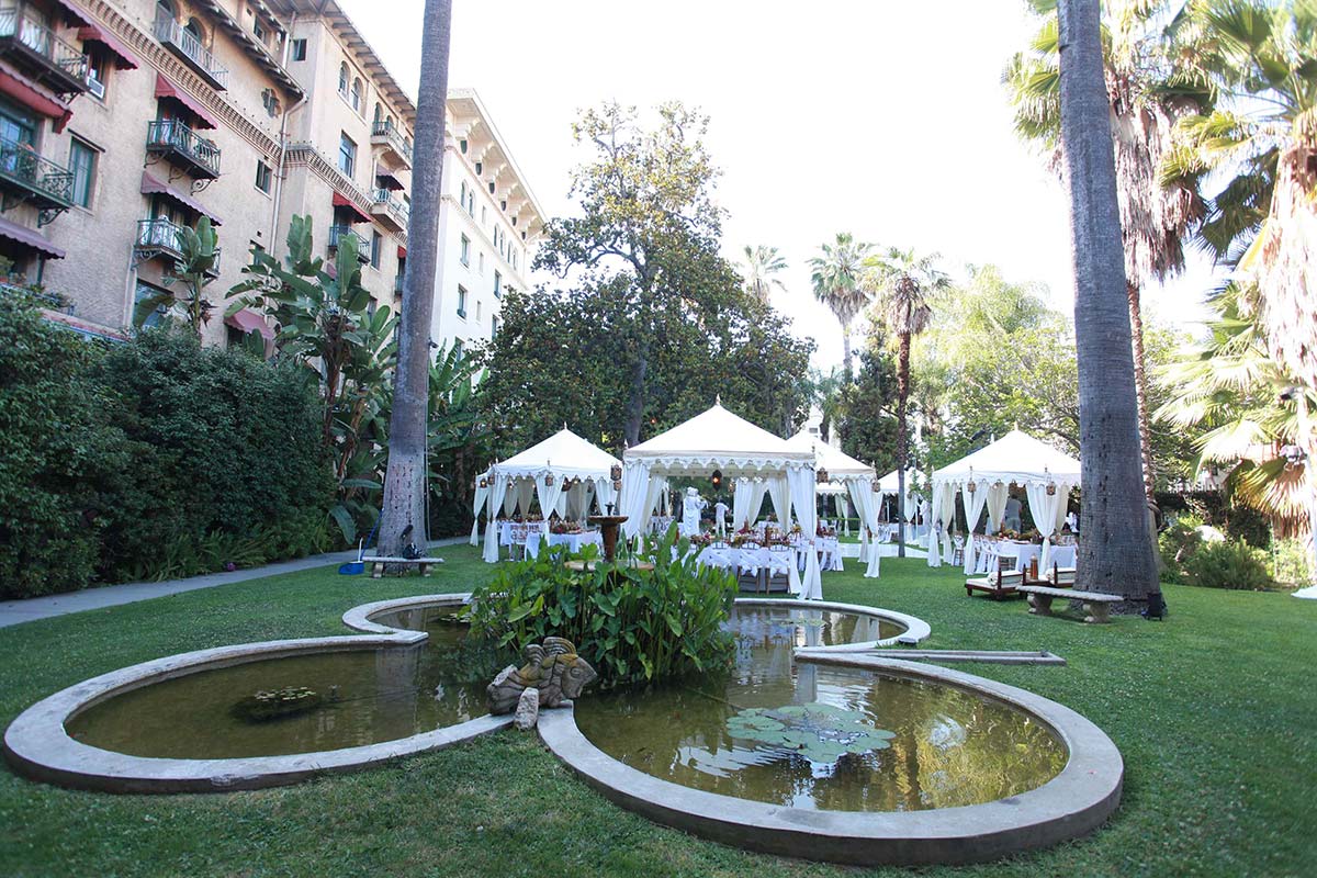 Tented reception by the pond.