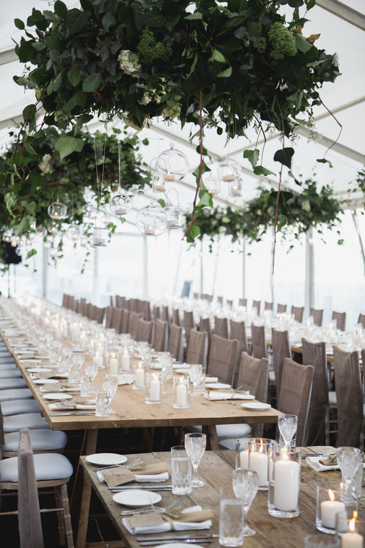 Hanging greenery adds a nice elegant touch to the reception space.