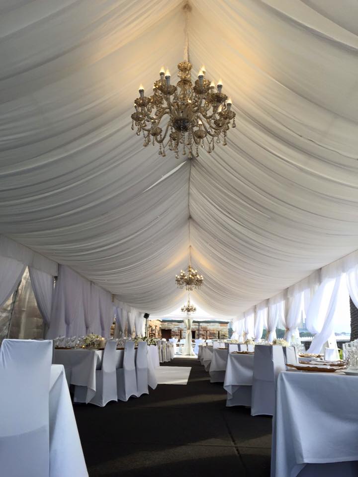 Add draping to the ceiling to make the space more luxurious for your event.