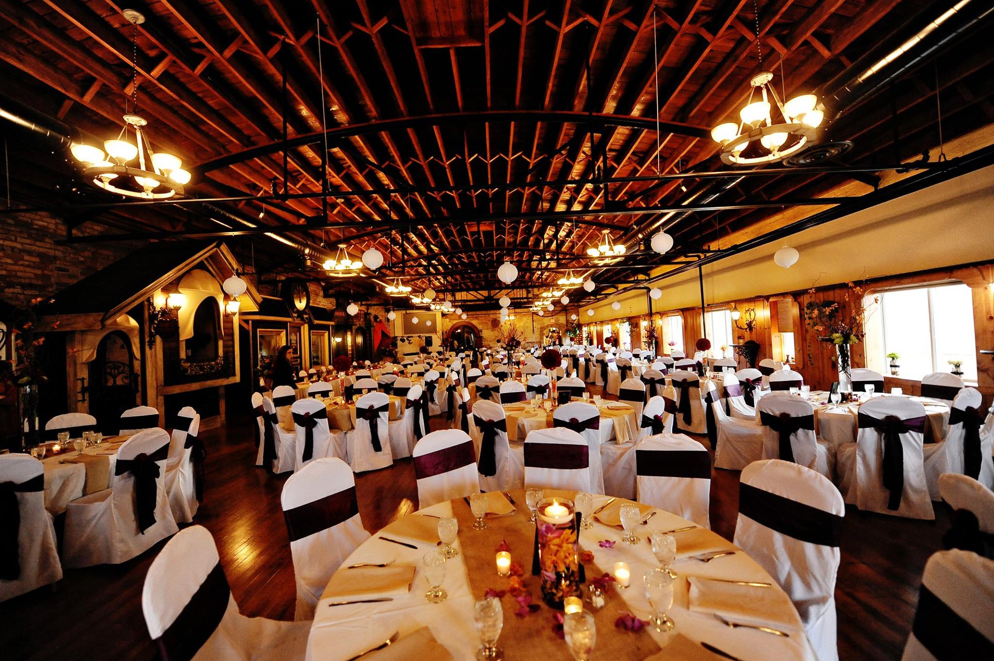 The banquet facility is designed to highlight the building’s historic architectural features with warm colors, and various textures of wood and brick.
