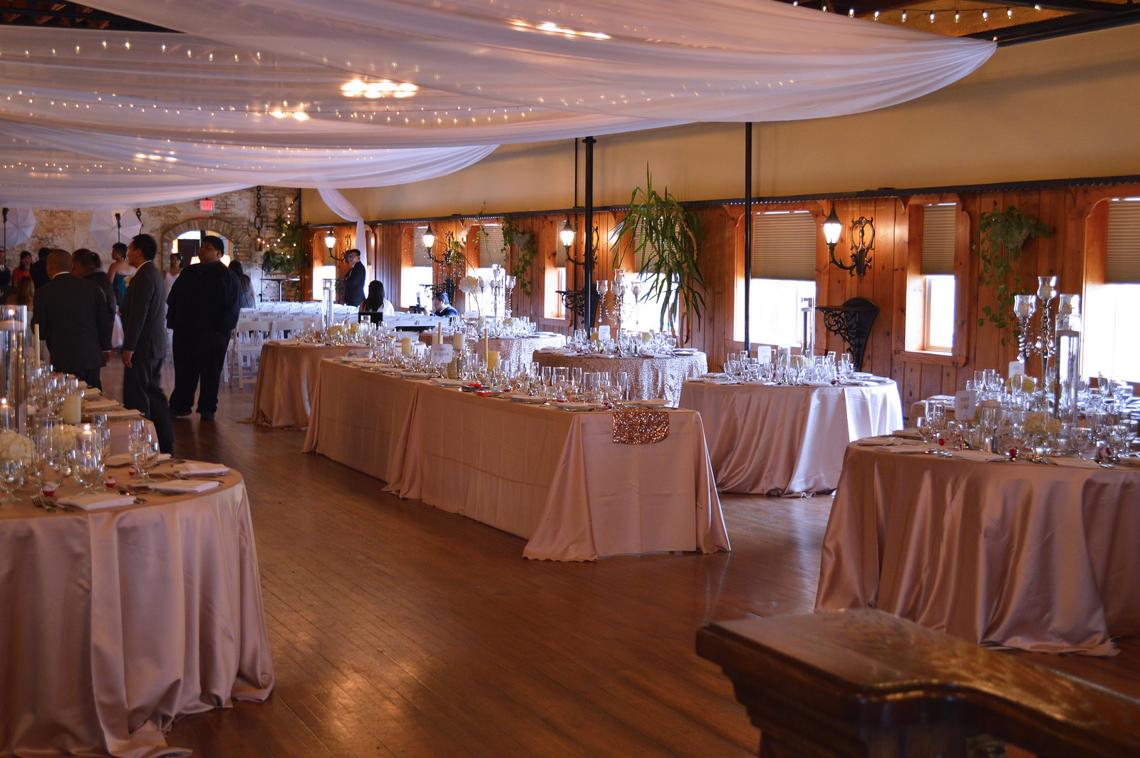 The banquet center has stunning archways, high ceilings, wood floors, European inspired storefronts, windows with a view of the enchanted garden courtyard, and a deck overlooking the city of White Bear Lake.