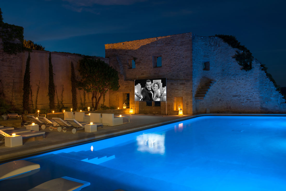 Enjoy a movie by the pool.
