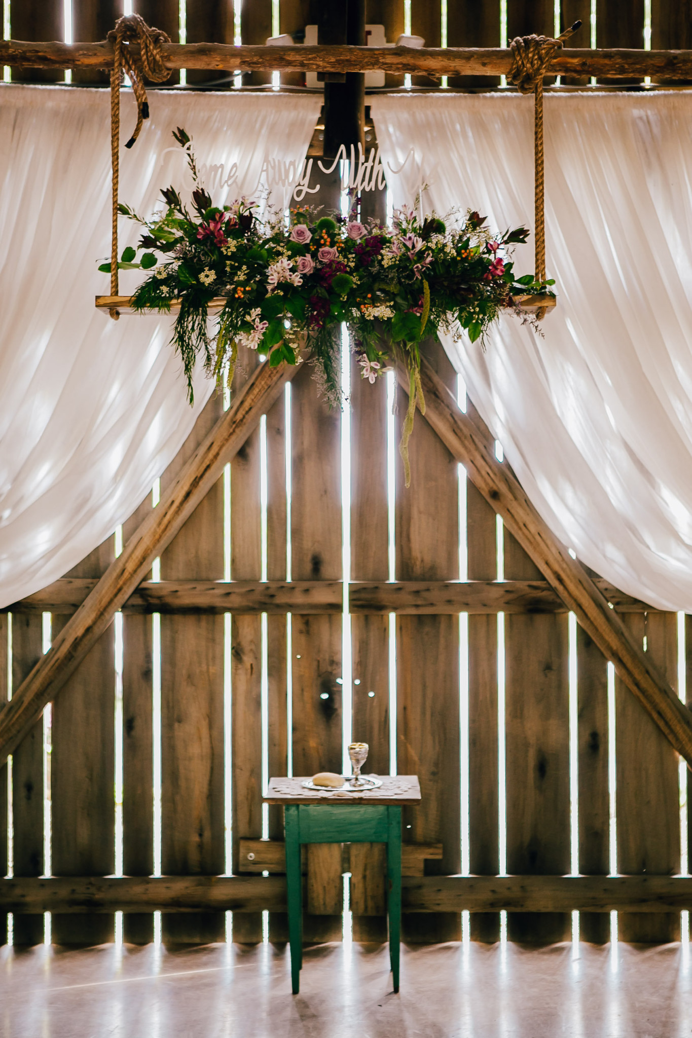 Light traveling through the old wooden barn.