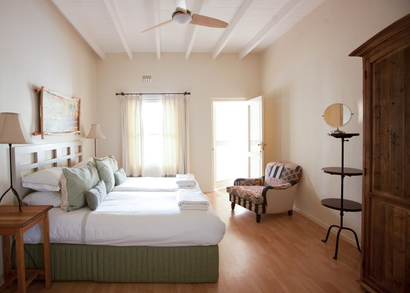 There are four double rooms with bathrooms in the beautifully furnished farmhouse and one separate suite outside, with its own secluded verandah looking over the veld and up to the mountains.