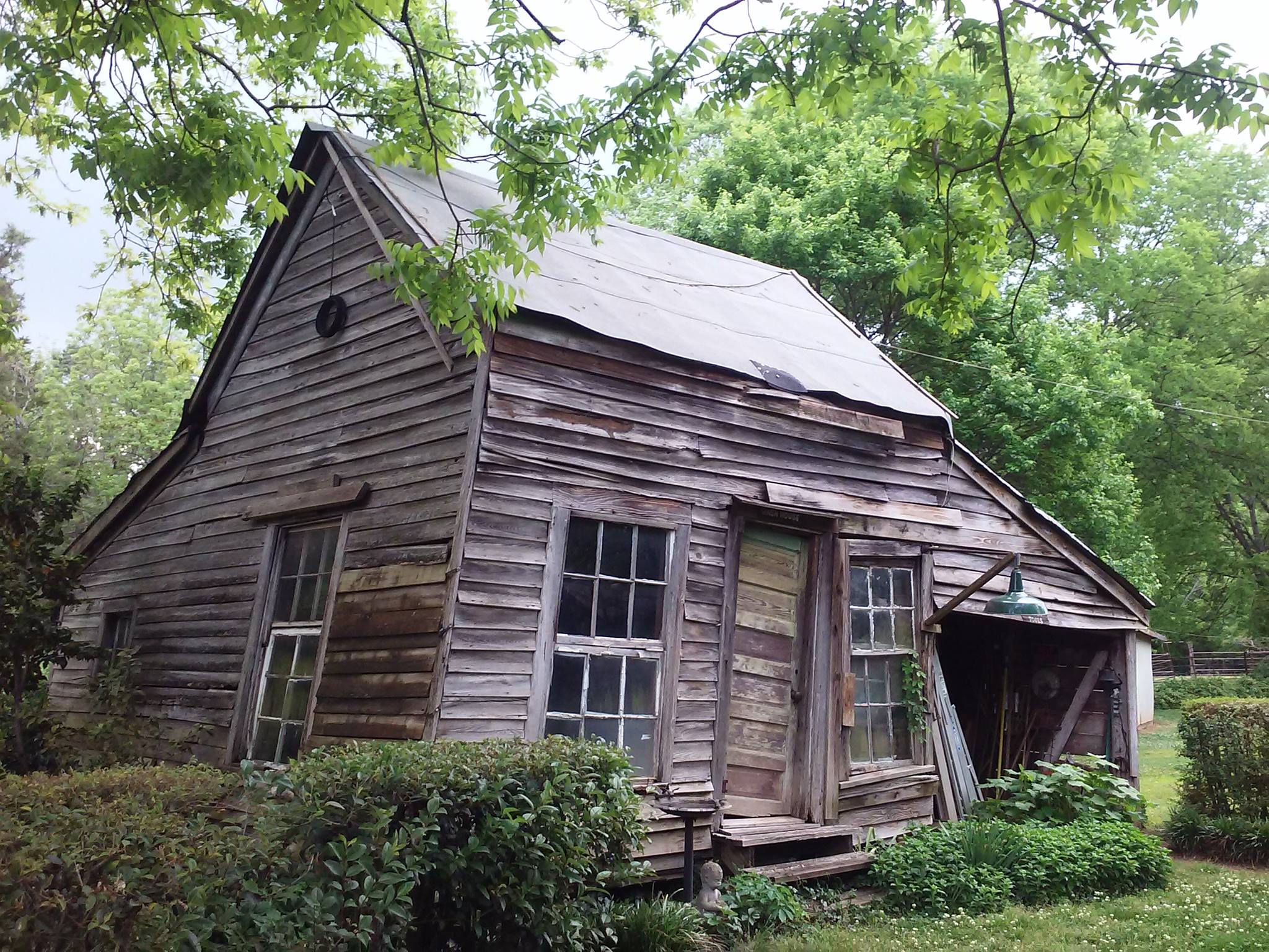 As you walk down the brick walkway, before you even get to the house, you will see our cabin; it is the oldest wooden structure in Rock Hill and makes a beautiful backdrop for photographs!