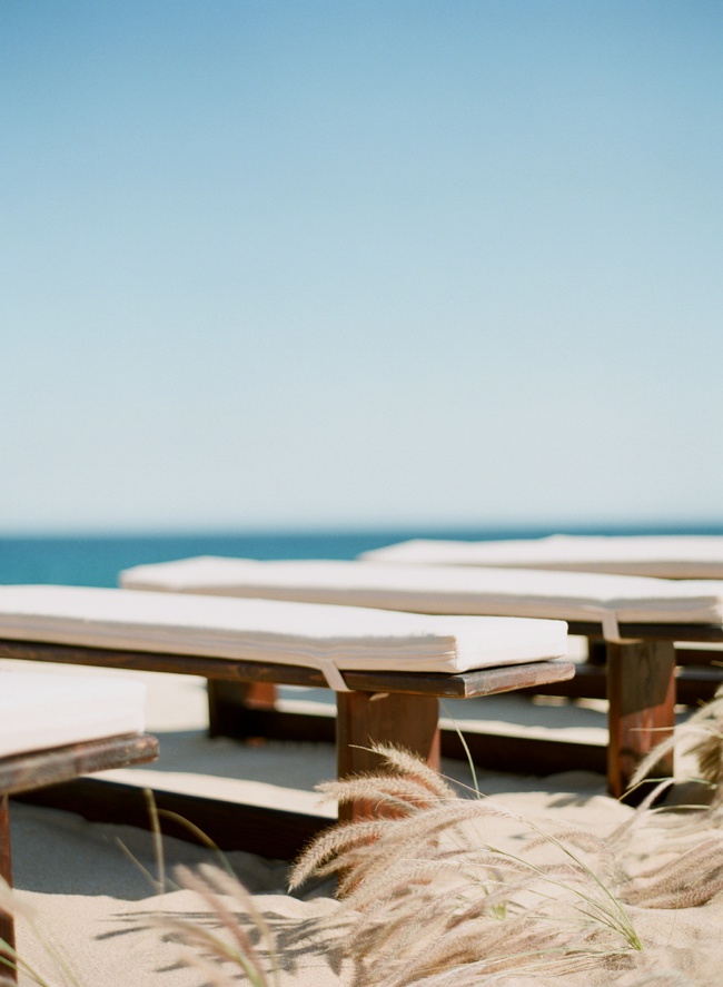 Benches on the sandy beach at this Cabo San Lucas beach wedding venue