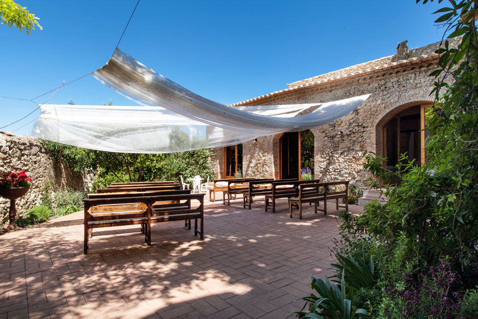 Surrounded by vineyards and completely enclosed within an ancient stone wall, the property was the original village of Olivella.