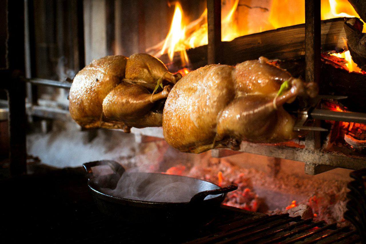 The outstanding design element of the space is the emerald green Universo wood-fired rotisserie-grill from Italy, the only one of its kind in the United States.