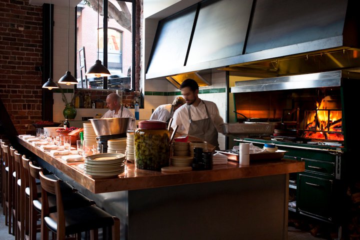 The open flow to the compact back-kitchen invites guests to peek into the bustling kitchen and pastry station.
