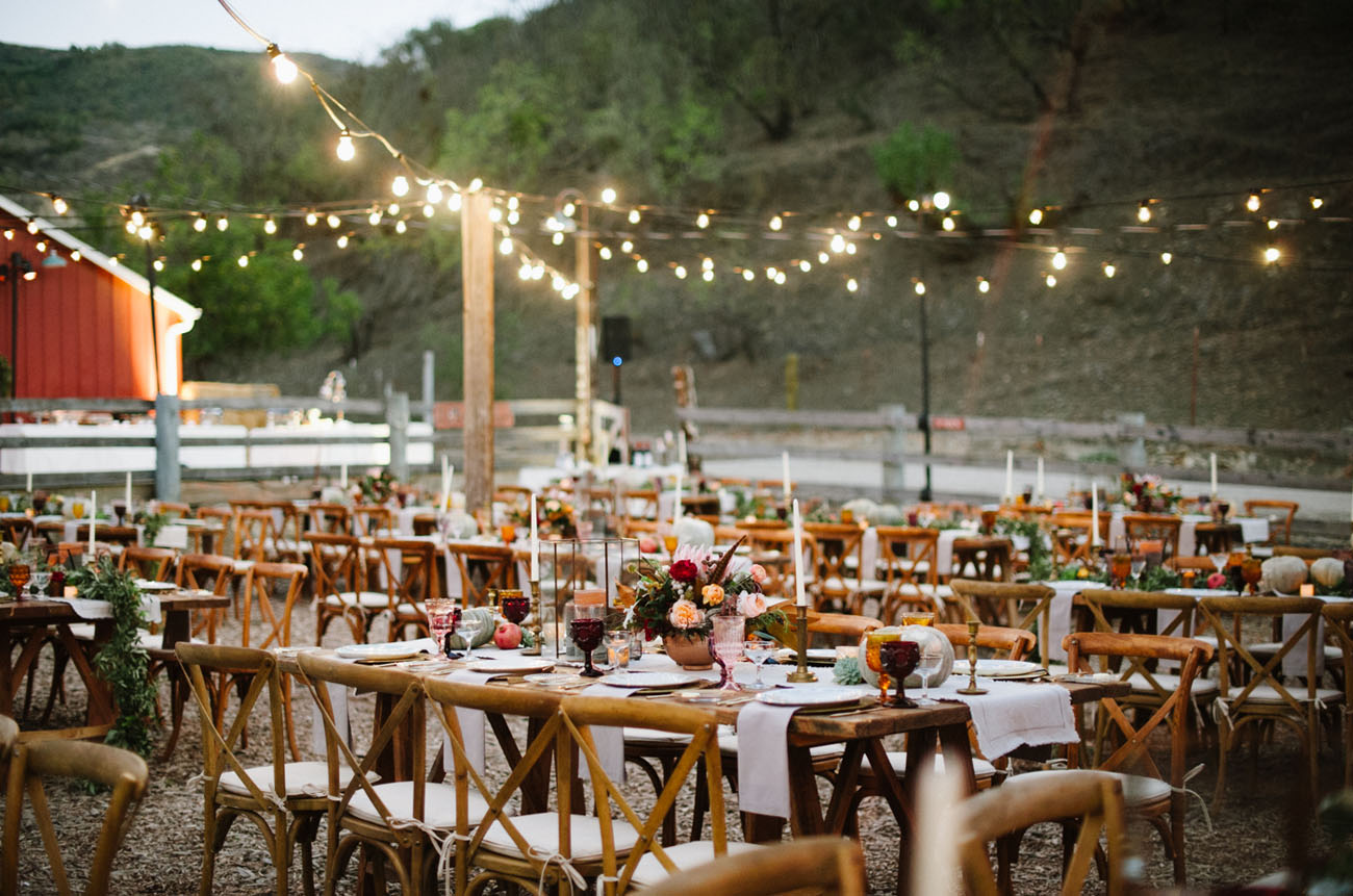 Outdoor reception with string lighting.