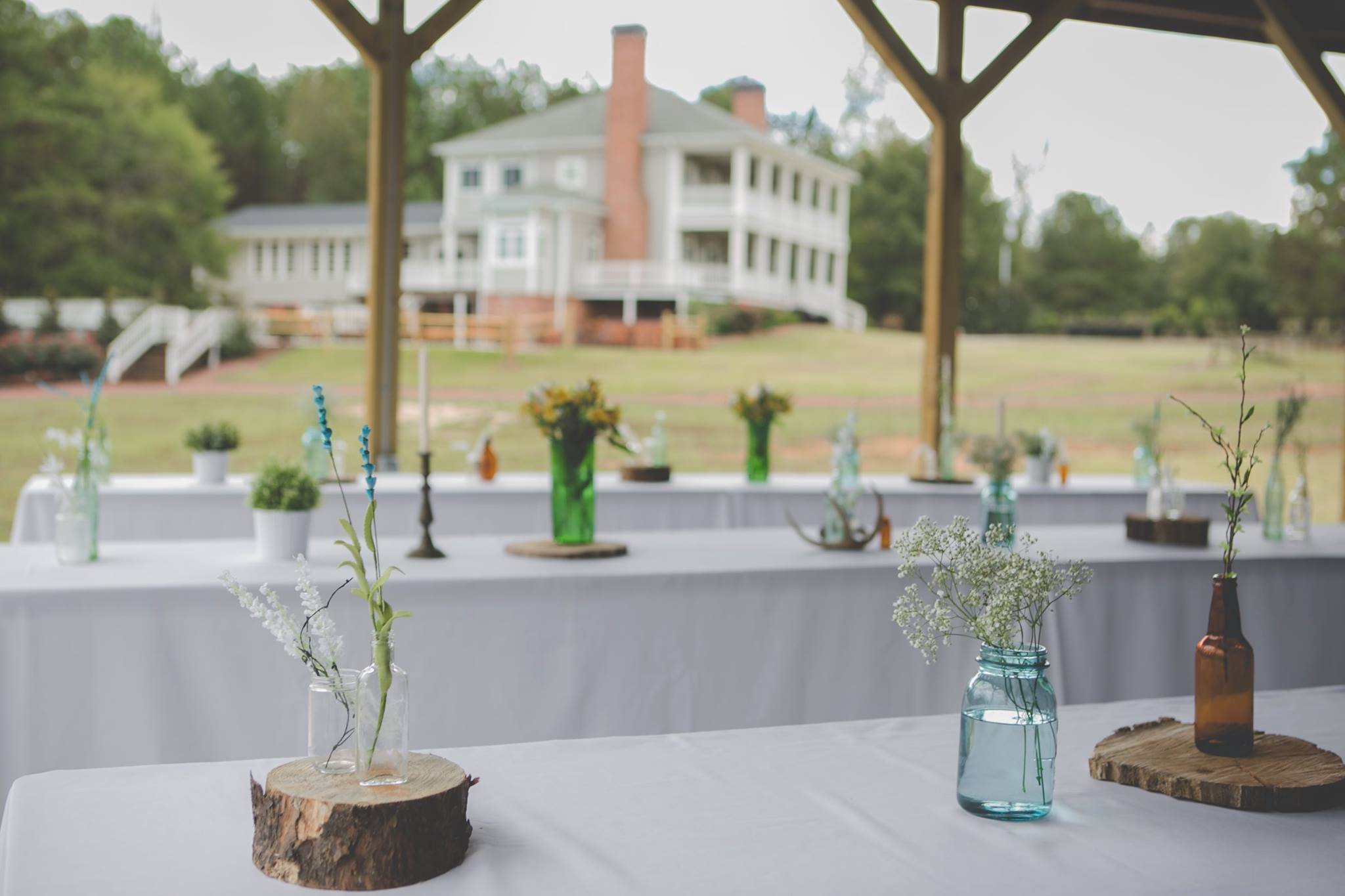 Tin roof covered with men's and women's restrooms, a full service catering kitchen with open serving barn windows.