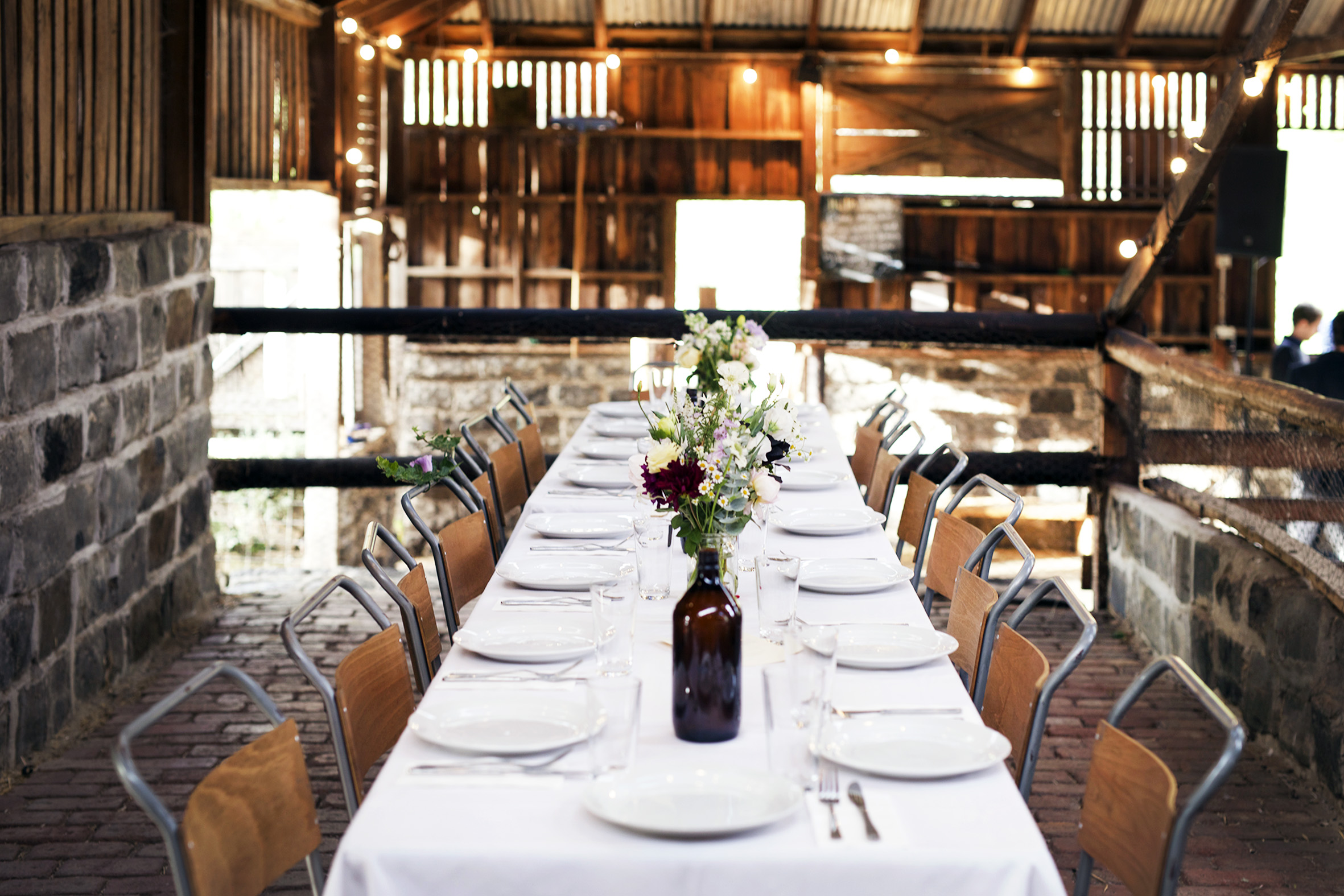 The stunning rustic barn is surrounded on all sides by farmland.