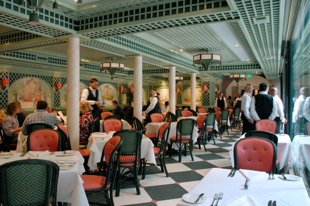 Chanteclair Room - A fantasy interpretation of a French Orangerie, the Main Dining Room “holds hands” with the courtyard, inviting the outside in through a spectacular wall of glass.