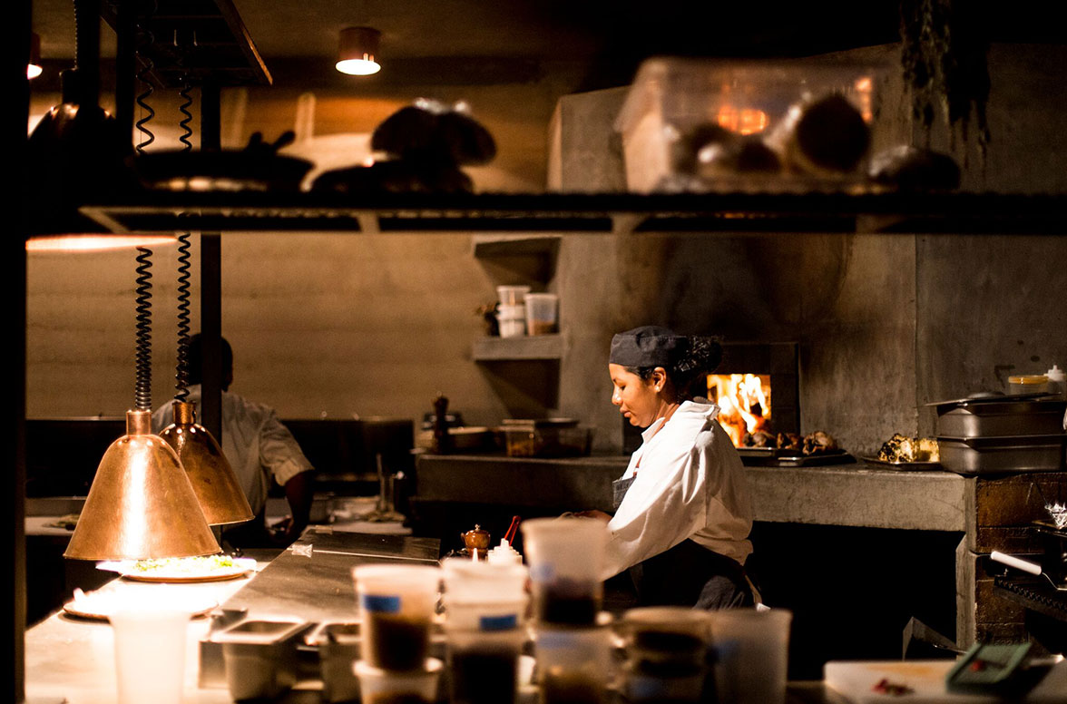 The heart of our resort has an open kitchen with copper accents, wood burning oven and grilled and is shaded with branches from local palo de arco trees!