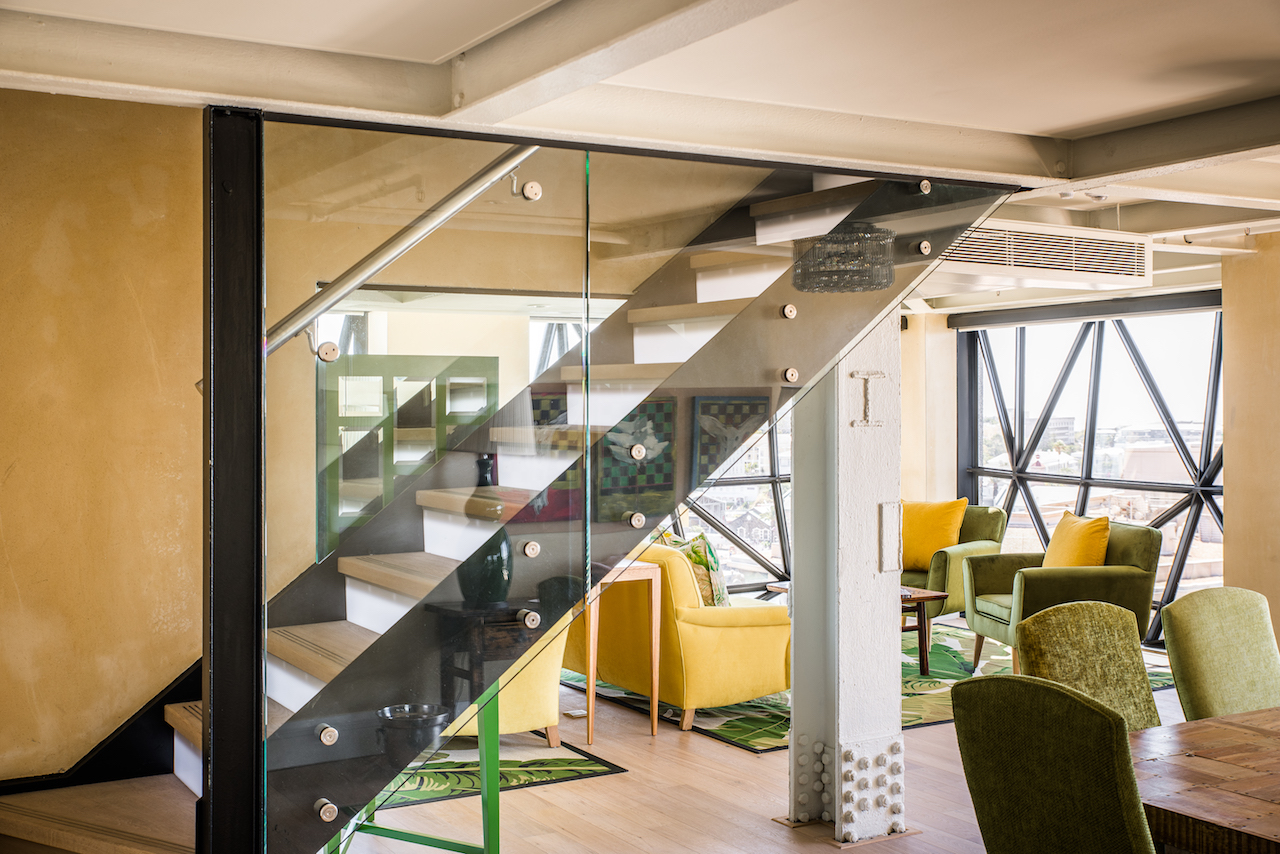 The bottom floor of one of the Family Suites showing the Dining Room table and Lounge.