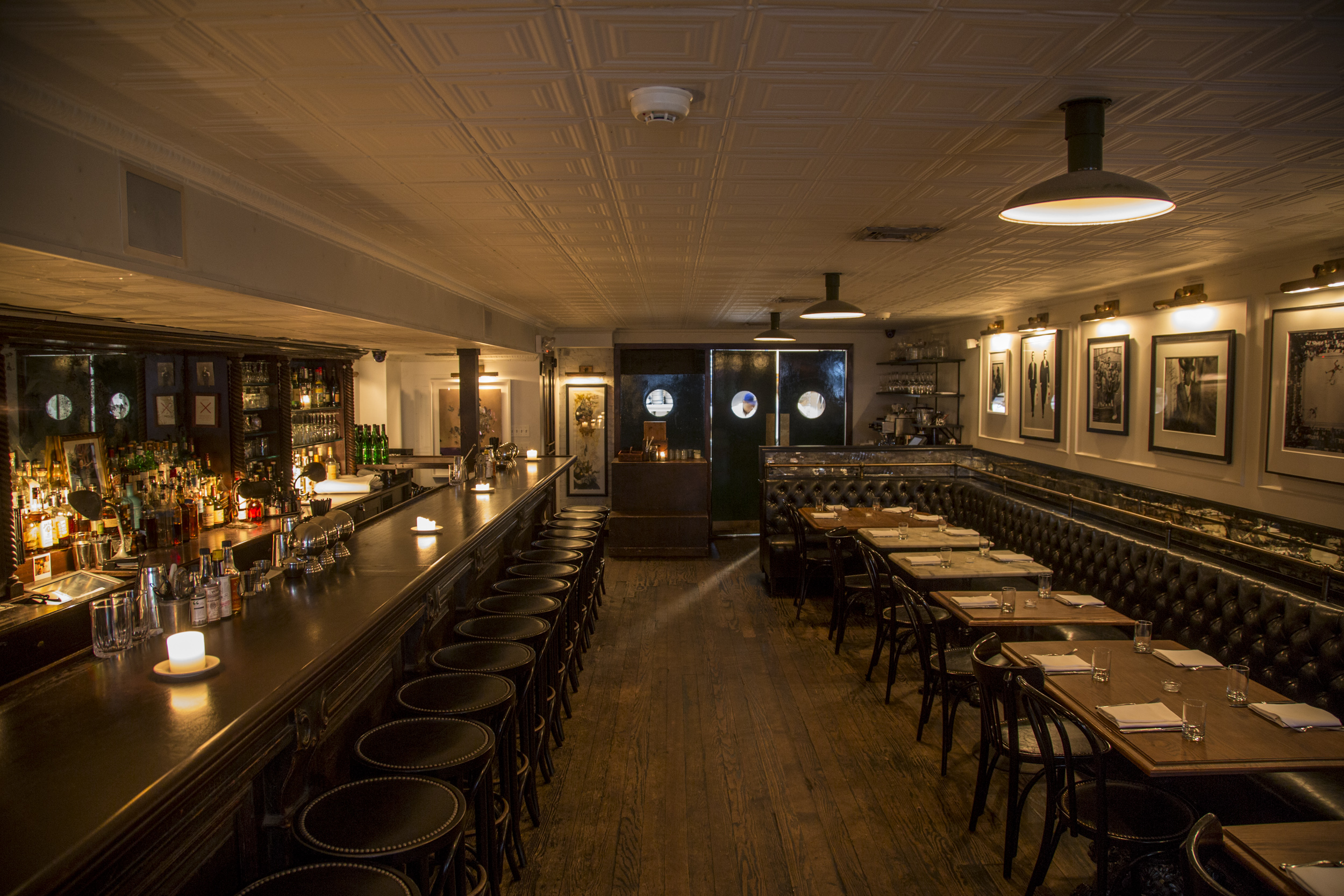 The dining room features a large, striking bar as well as table seating.