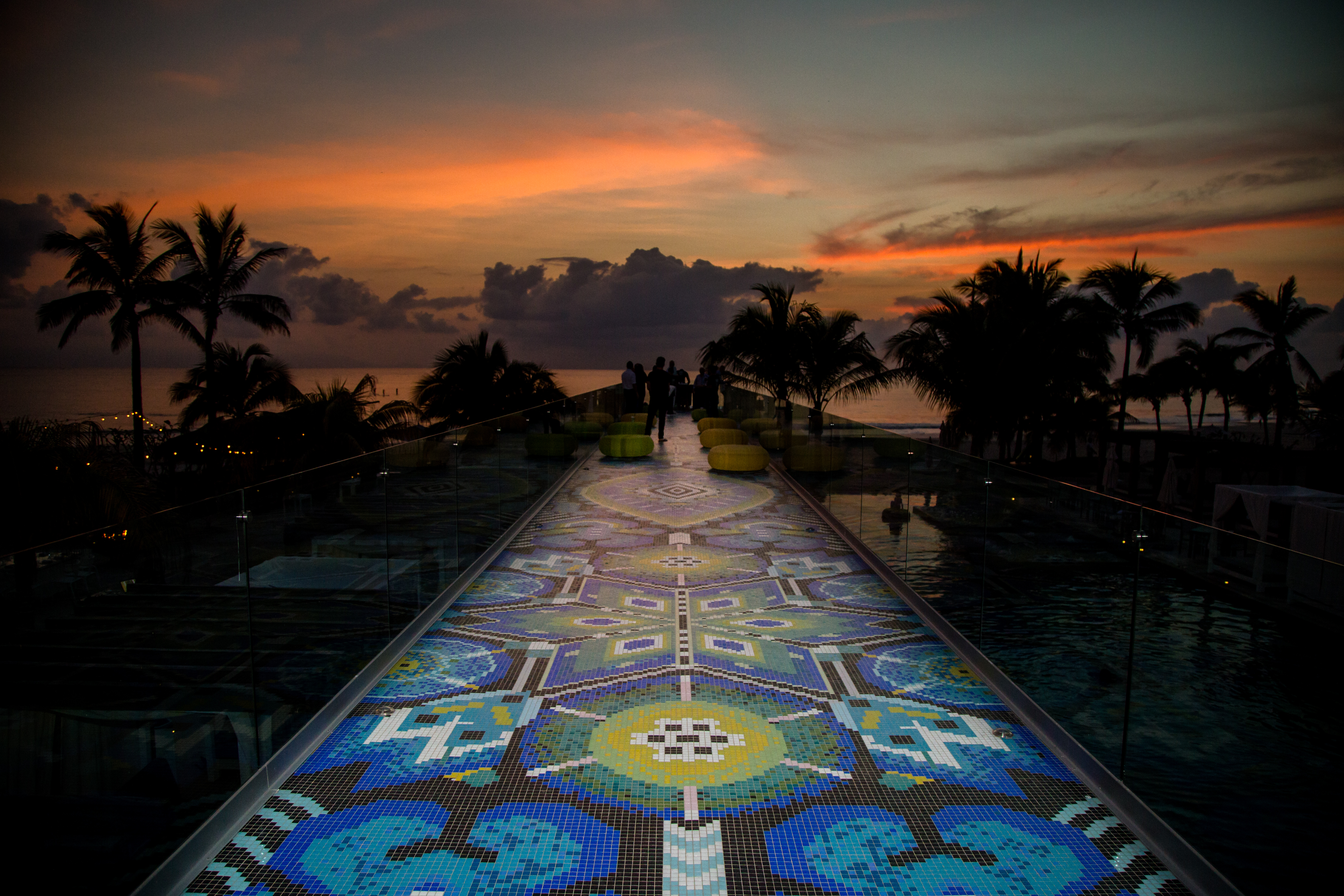 A bright blue and green mosaic "Camino Huichol" walkway, stretching over 450 feet.
