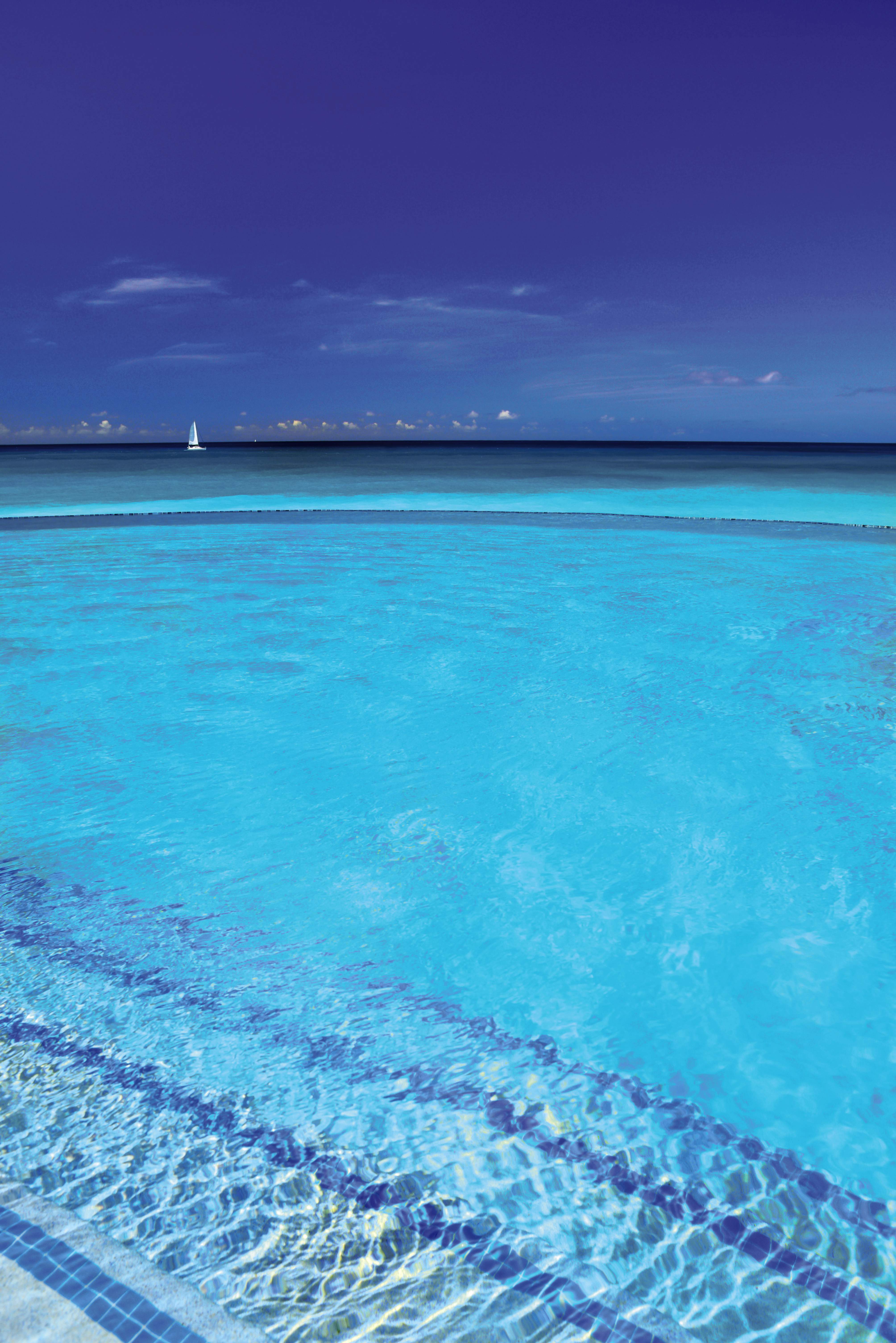 SWIMMING POOLOur main pool, 5ft deep and 30ft long, is open daily from 9am to 5pm. It’s the perfect place to lay back and soak up the island ambience.A second freeform infinity pool is 5ft deep and 15ft long. Adjacent to the beach bar and restaurant