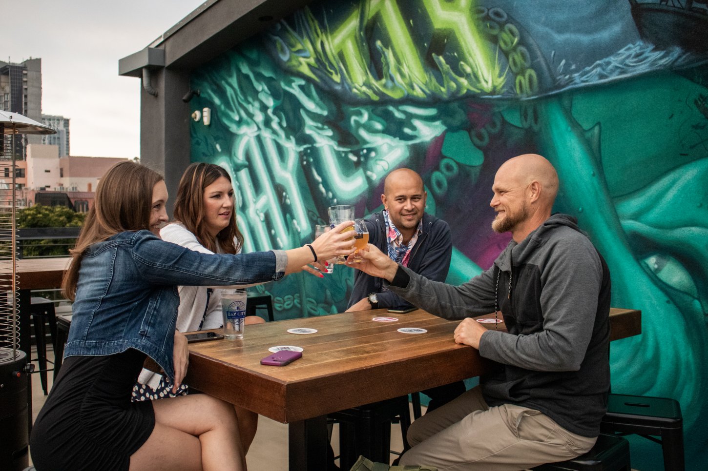 Cheers on the rooftop of Bay City Brewing East Village