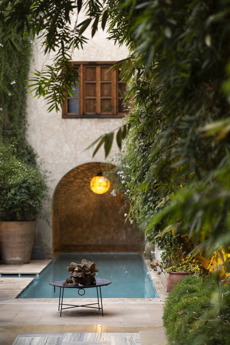 Shaded colonnade courtyard pool for cooling dips
